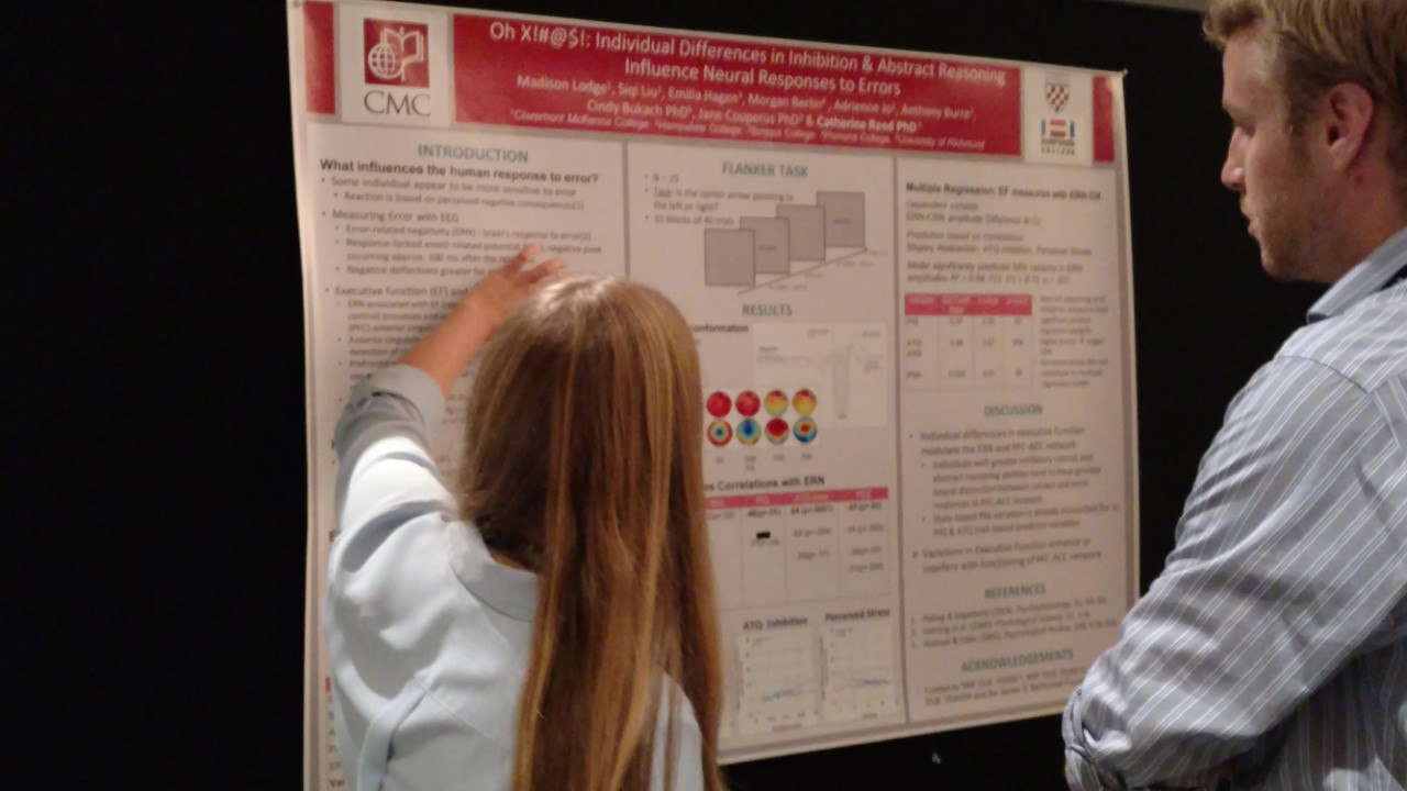 Madison describes research to interested viewer